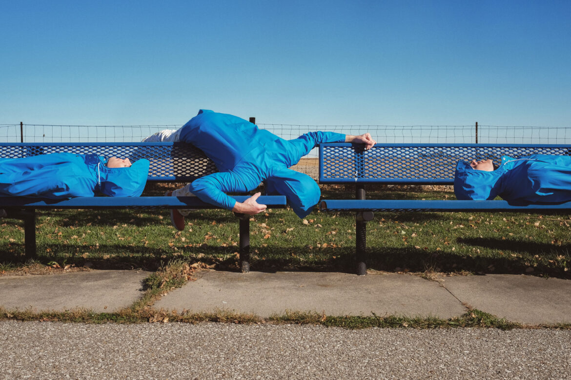 Blue Man on Bench Free Stock Photo