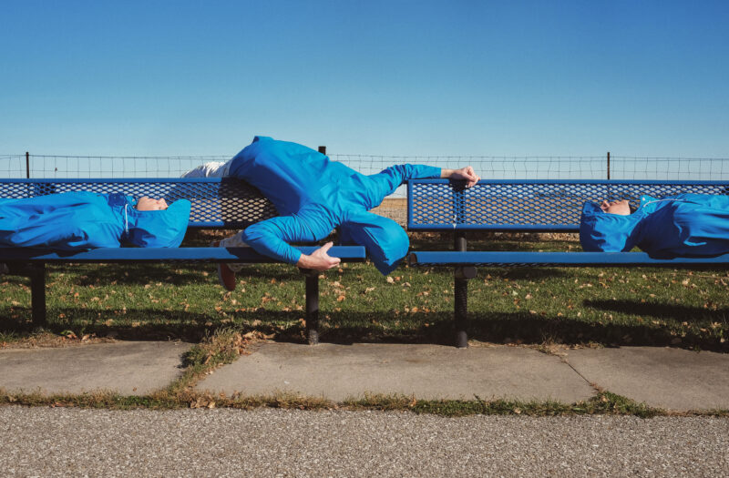 Blue Man on Bench Free Stock Photo