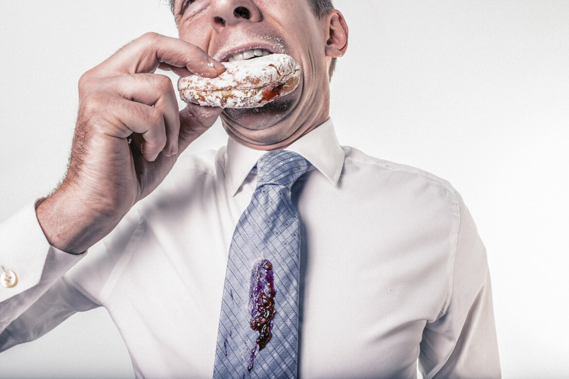 Man Eating Donut Free Stock Photo