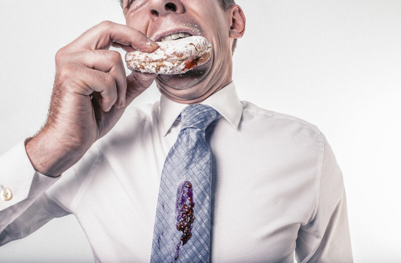 Man Eating Donut Free Stock Photo