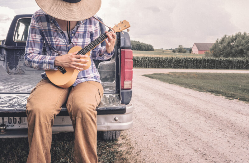View Farmer Playing Small Guitar Free Stock Image