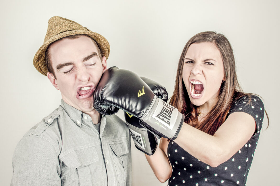 Woman Punching a Man Free Stock Photo