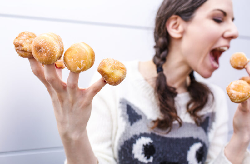 Woman with Donut Fingers Free Stock Photo